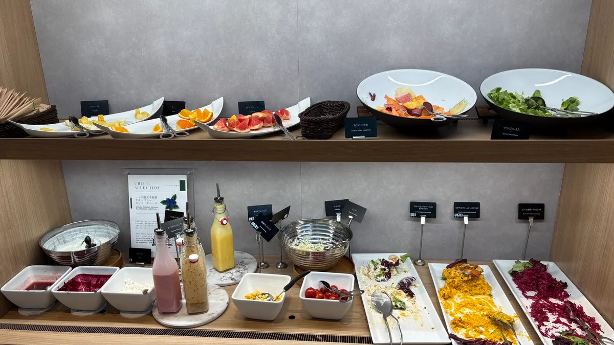 The salad section of the breakfast buffet with several bowls